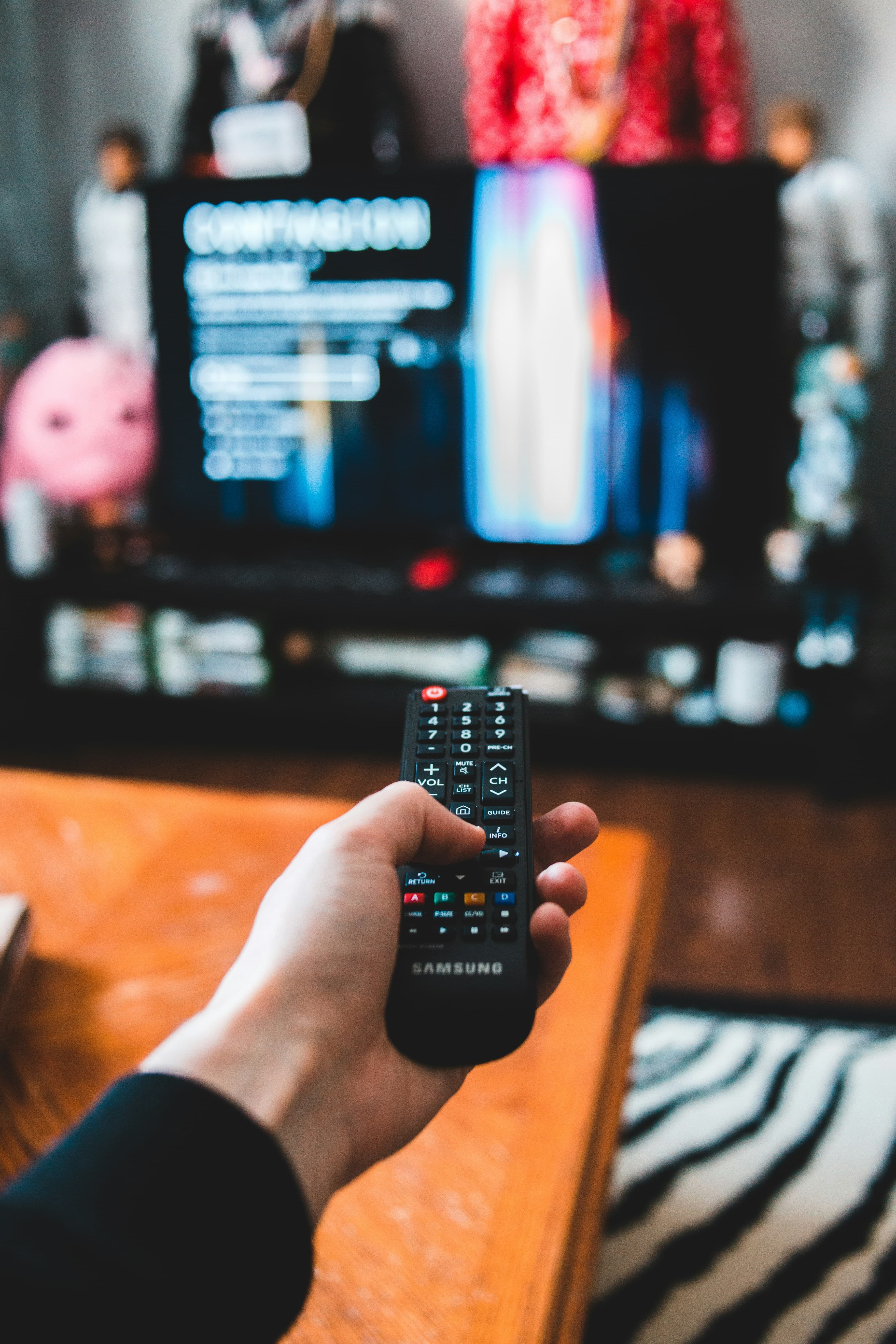 Remote control pointed towards a TV